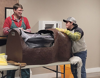 Person using life size calving model.