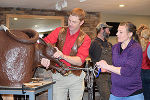 Calving clinic participants practice techniques.